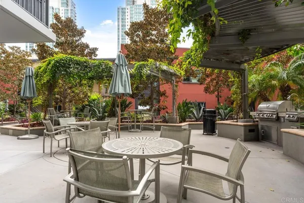a hallway with a large dining table chair and a large window
