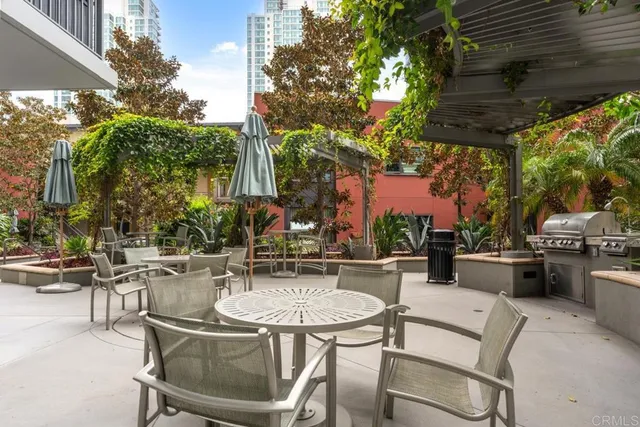 a hallway with a large dining table chair and a large window