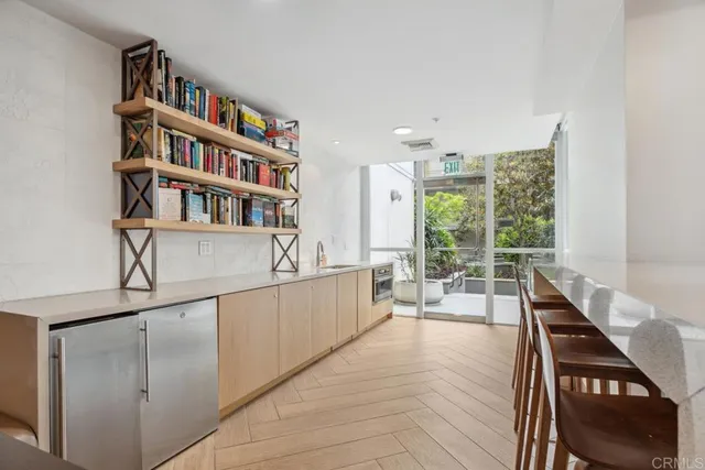a kitchen with a refrigerator and a sink