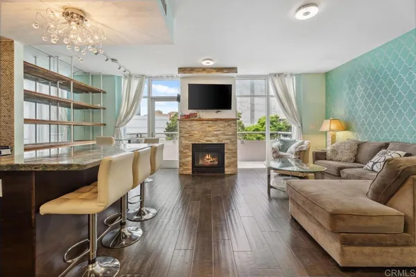 an empty room with wooden floor and stairs