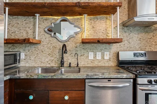 a kitchen with a table and chairs