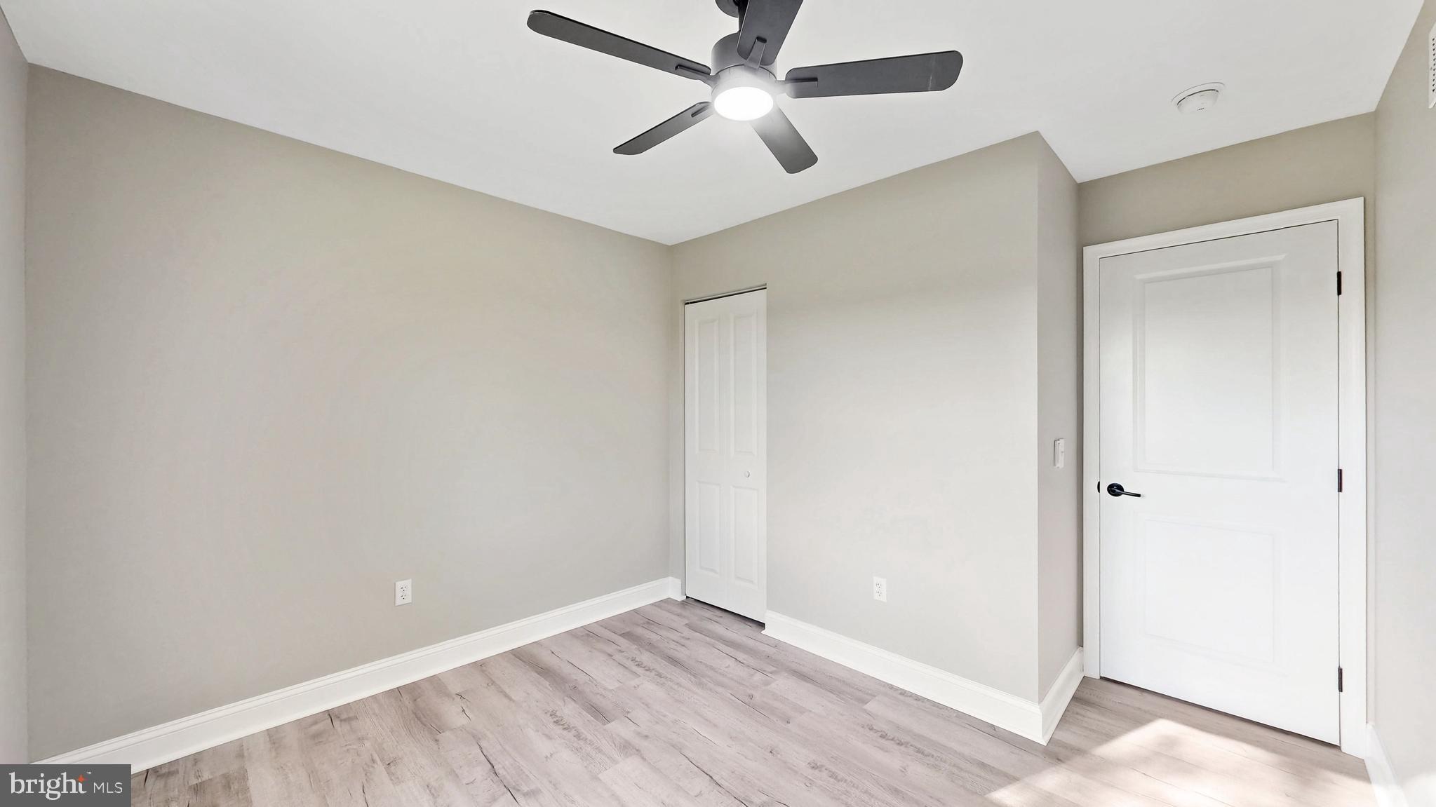 3318 Underwoods Corner Road Clayton, DE 19938 - Photo 21 of 54 an empty room with a ceiling fan and a window