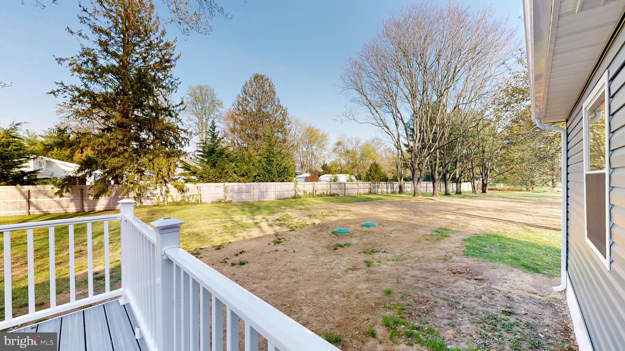 3318 Underwoods Corner Road Clayton, DE 19938 - Photo 43 of 54 a view of a yard with trees in front of it