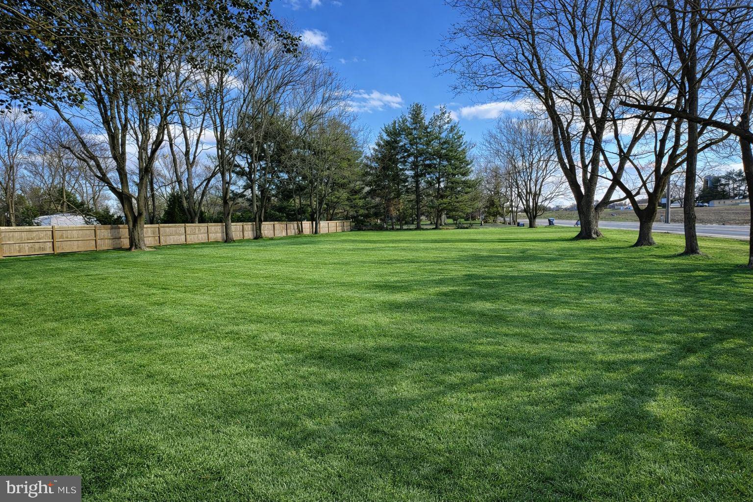3318 Underwoods Corner Road Clayton, DE 19938 - Photo 49 of 54 a grassy field with trees in the background