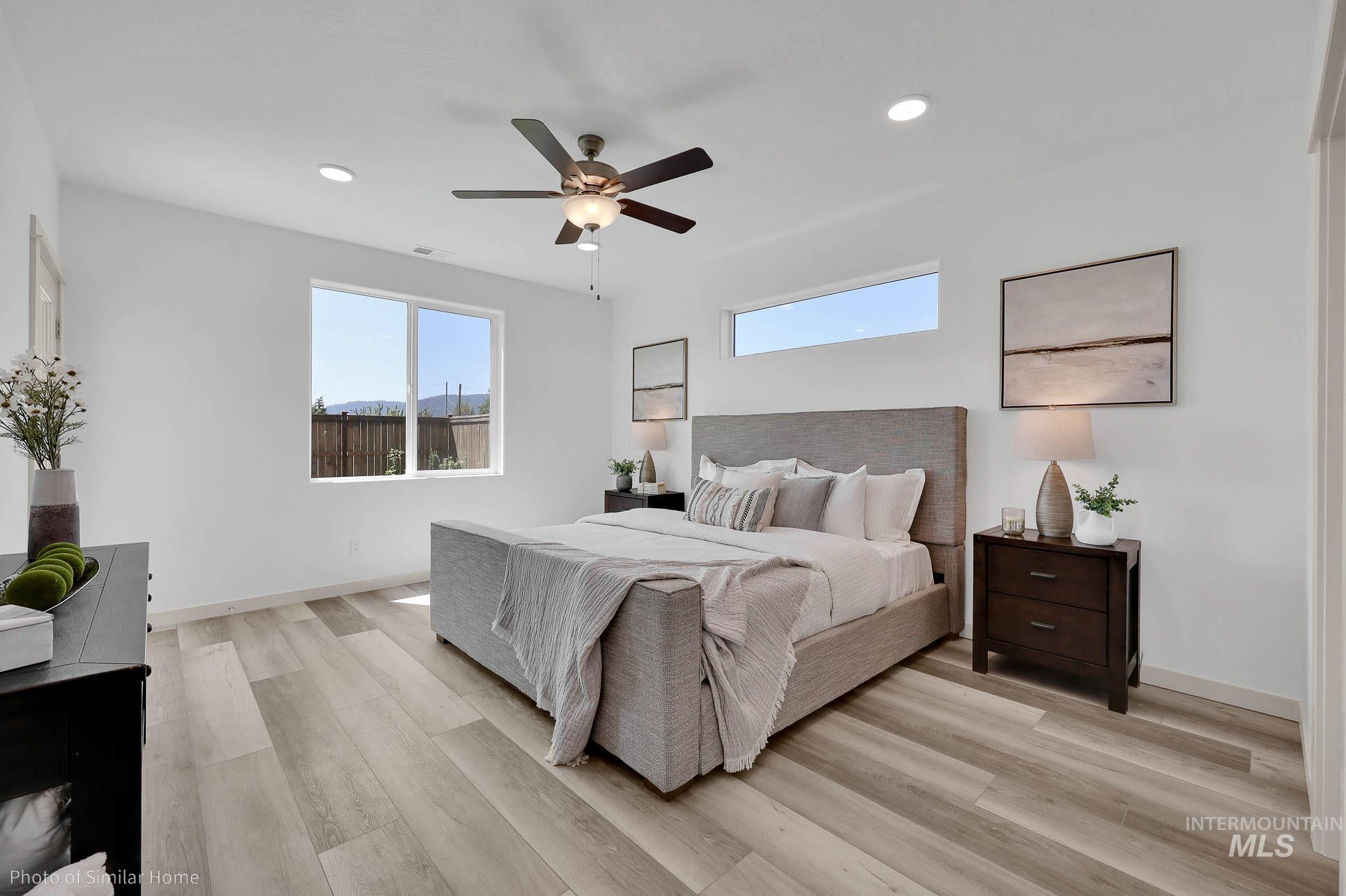389 West Gleason Court Meridian, ID 83646 - Photo 5 of 6 Bedroom with ceiling fan, light wood finished floors, and recessed lighting