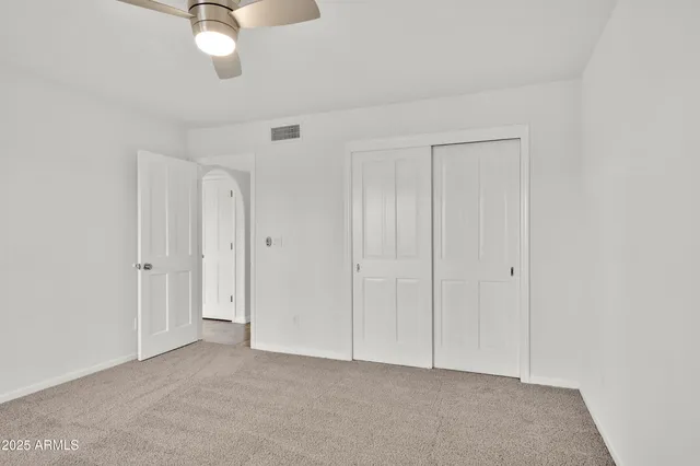 an empty room with fan