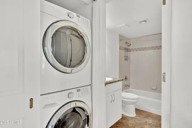 a view of a room with wooden floor and windows