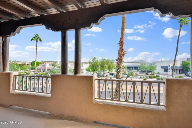 a view of a house with swimming pool and sitting area