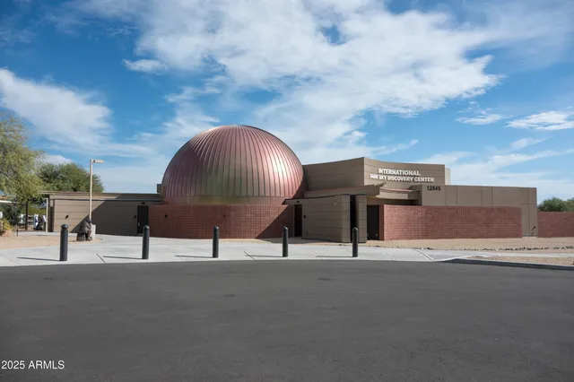 a group of people sitting in a roof deck