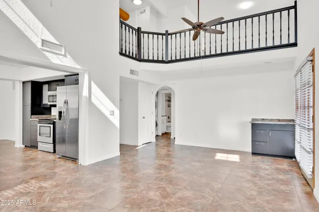 a view of an entryway wooden floor and a living room