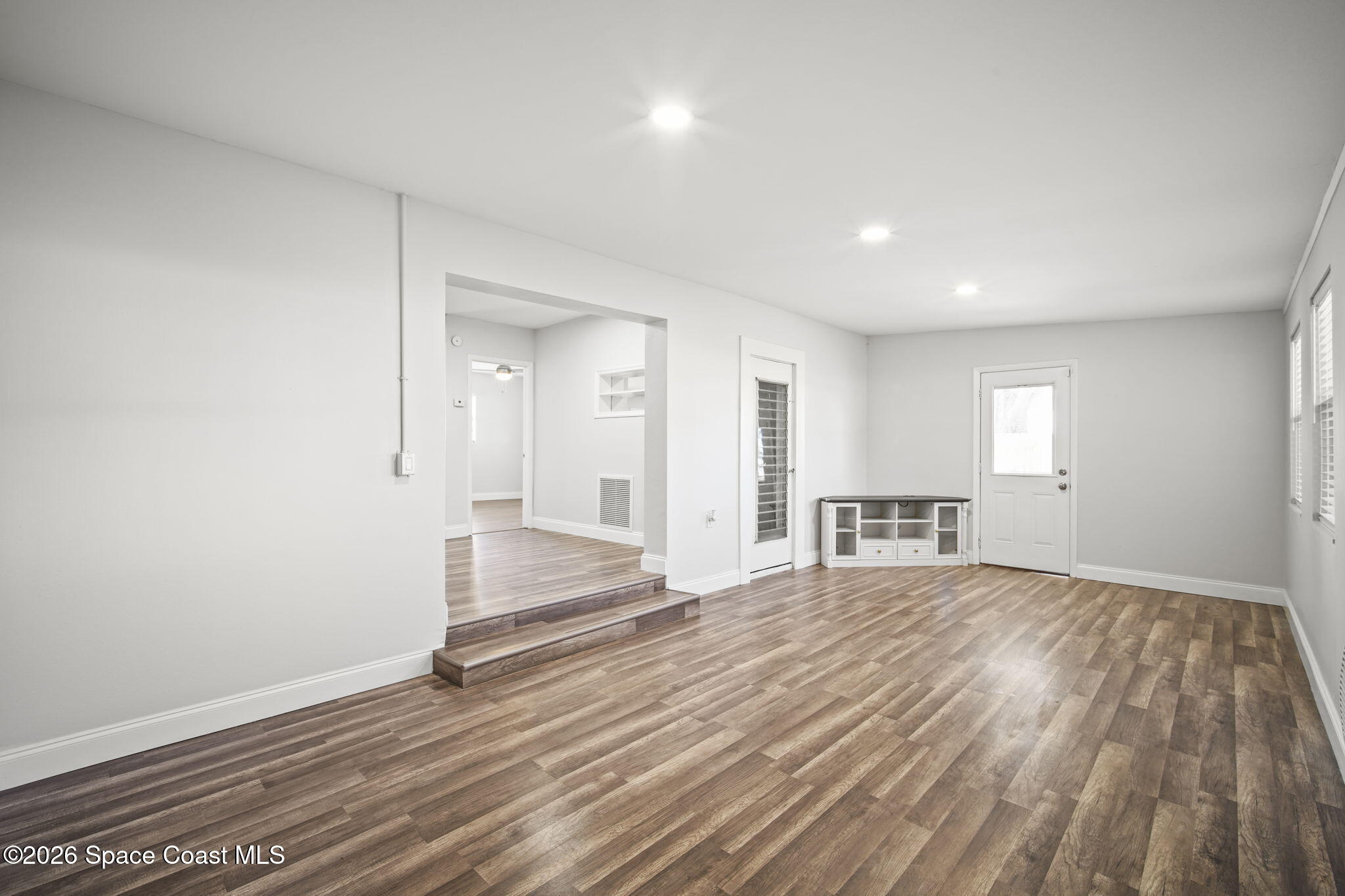 4665 Tuscarora Road Titusville, FL 32780 - Photo 16 of 34 a view of empty room with wooden floor