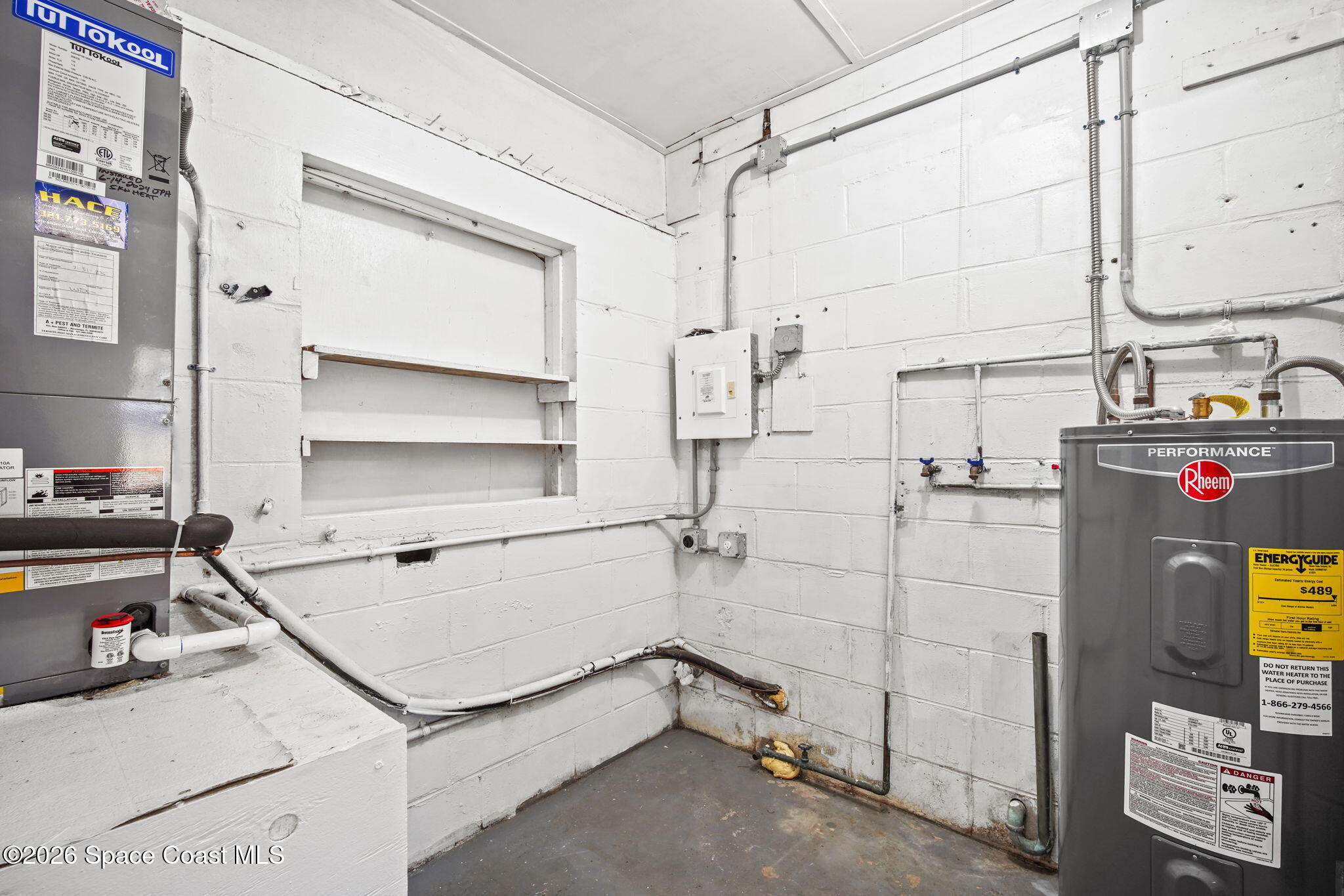 4665 Tuscarora Road Titusville, FL 32780 - Photo 26 of 34 a utility room with dryer and washer