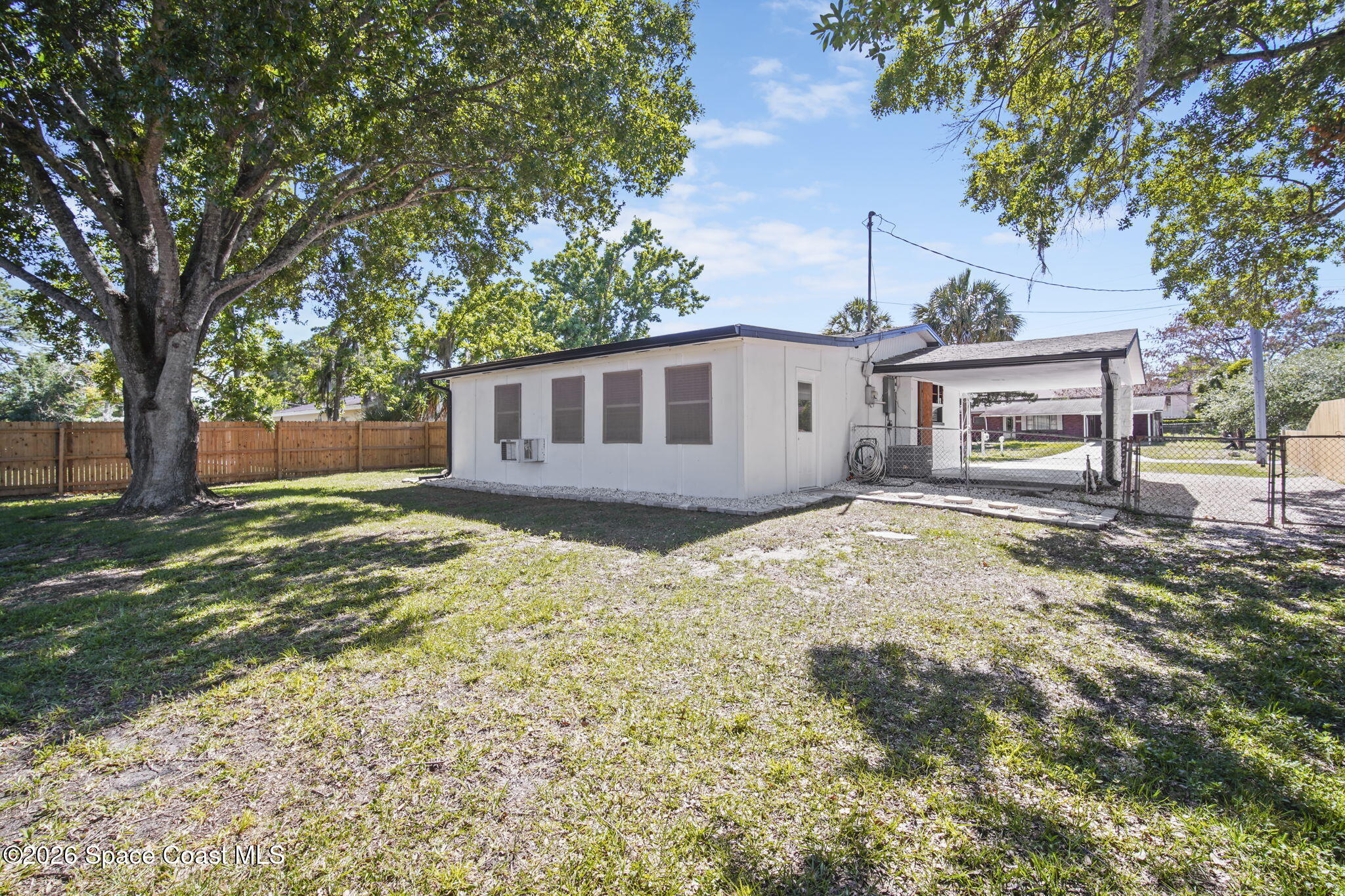 4665 Tuscarora Road Titusville, FL 32780 - Photo 27 of 34 front view of a house with a yard