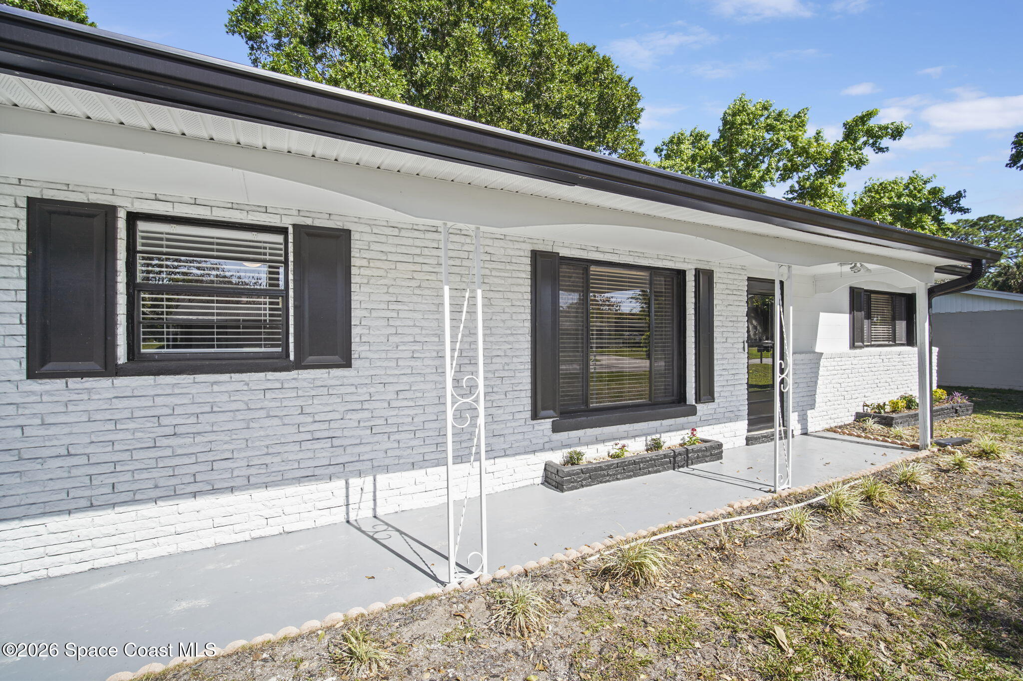 4665 Tuscarora Road Titusville, FL 32780 - Photo 4 of 34 a view of house with outdoor space