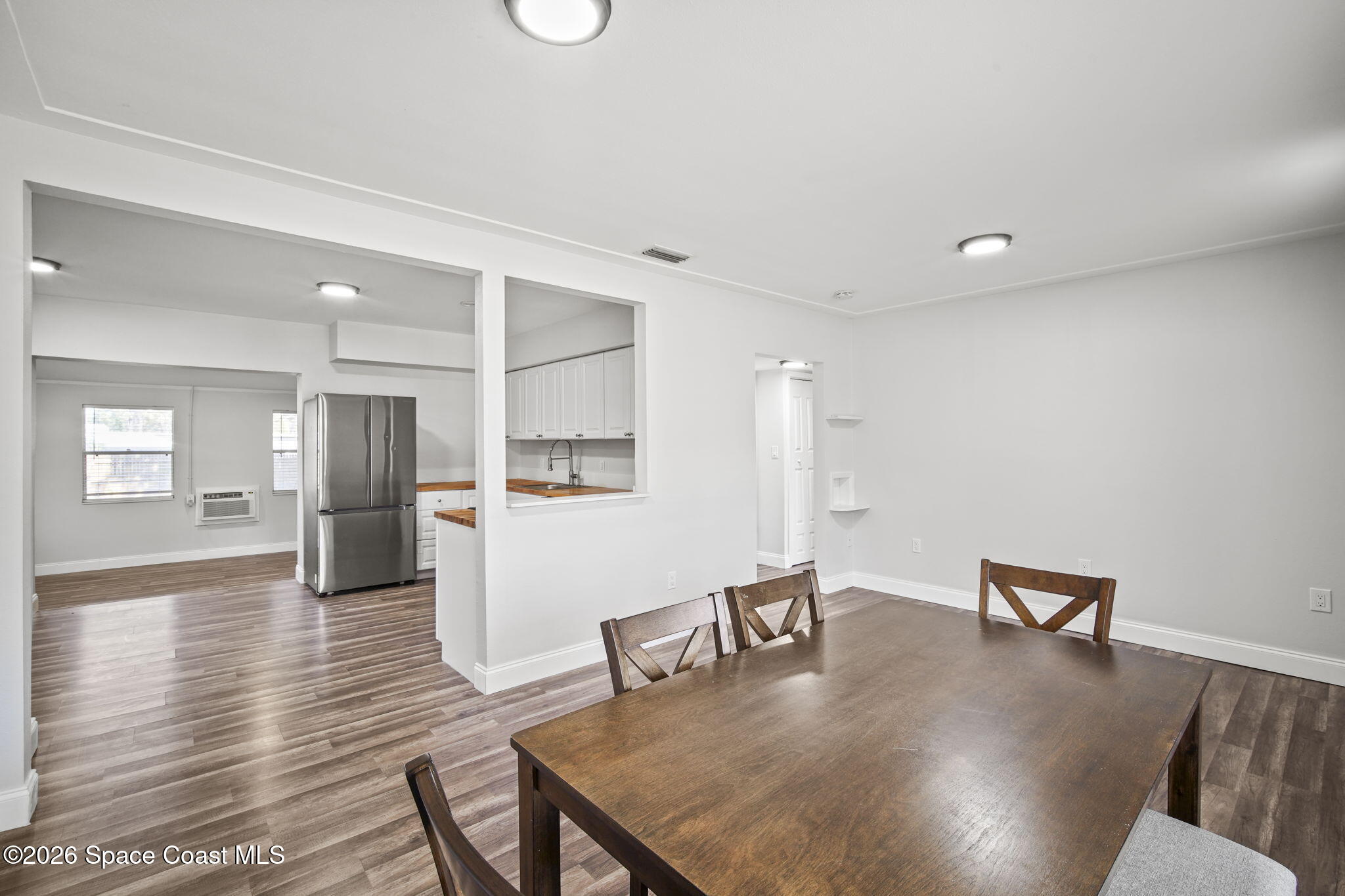 4665 Tuscarora Road Titusville, FL 32780 - Photo 8 of 34 a dining room with furniture and wooden floor