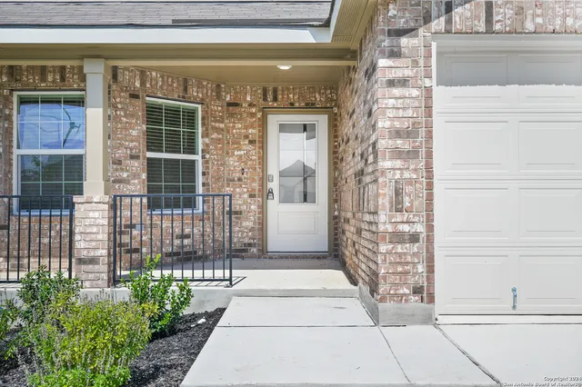 a front view of a house with a glass door