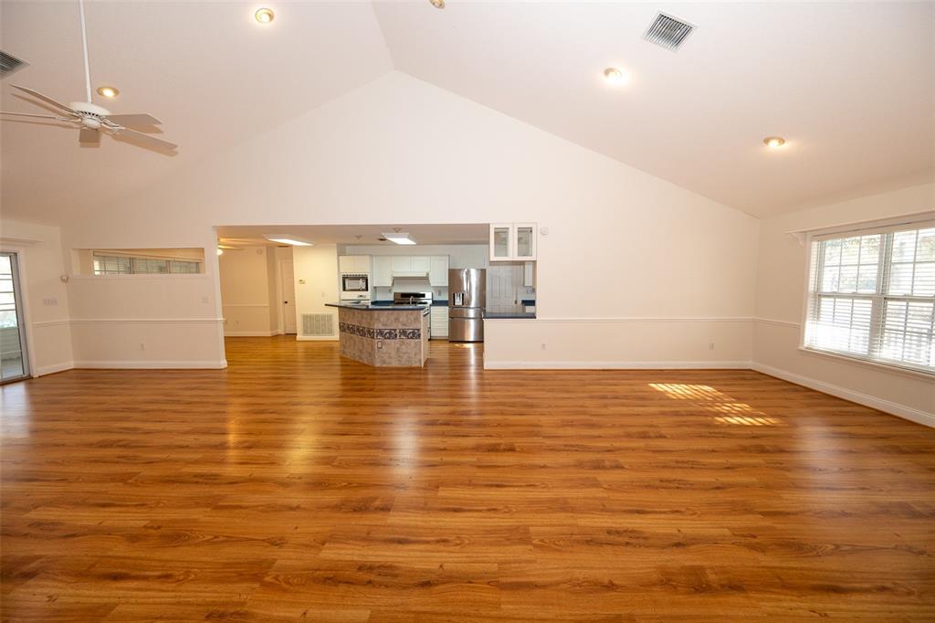 8077 Lake Hatchineha Road Haines City, FL 33844 - Photo 11 of 45 a view of empty room with wooden floor