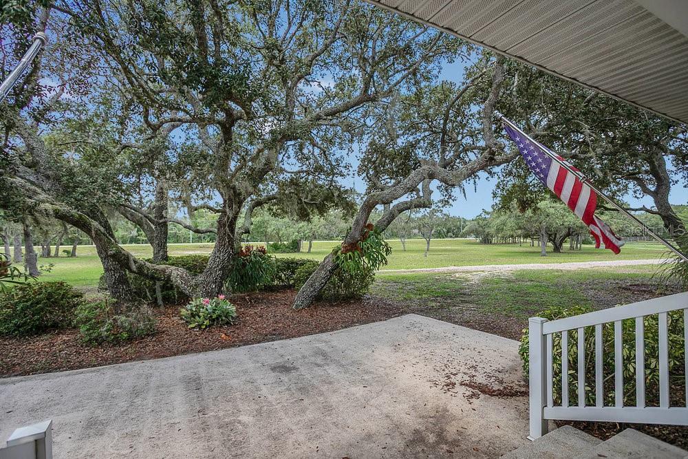 8077 Lake Hatchineha Road Haines City, FL 33844 - Photo 2 of 45 a view of a park with large trees