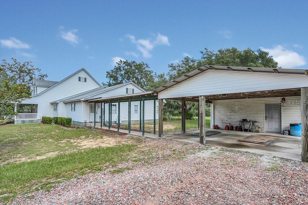 8077 Lake Hatchineha Road Haines City, FL 33844 - Photo 28 of 45 a front view of a house with a yard and porch
