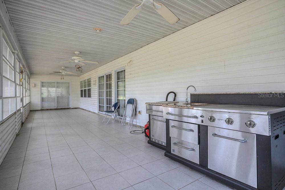8077 Lake Hatchineha Road Haines City, FL 33844 - Photo 29 of 45 a kitchen with cabinets and appliances