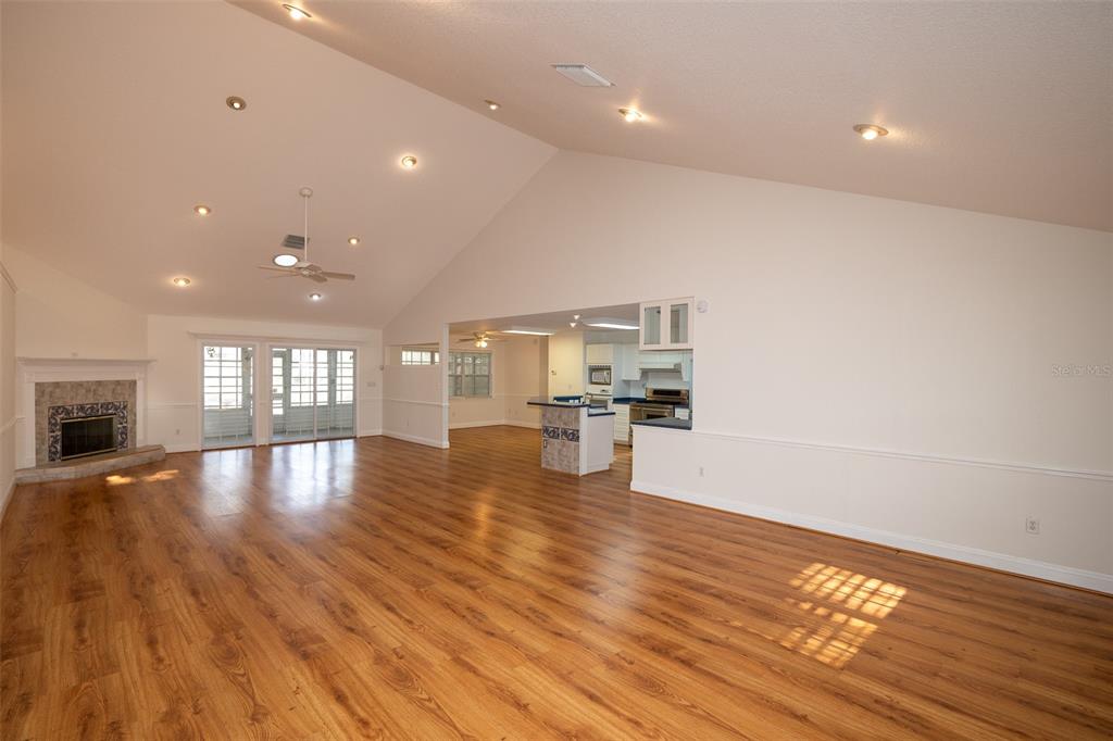 8077 Lake Hatchineha Road Haines City, FL 33844 - Photo 4 of 45 a view of empty room with wooden floor