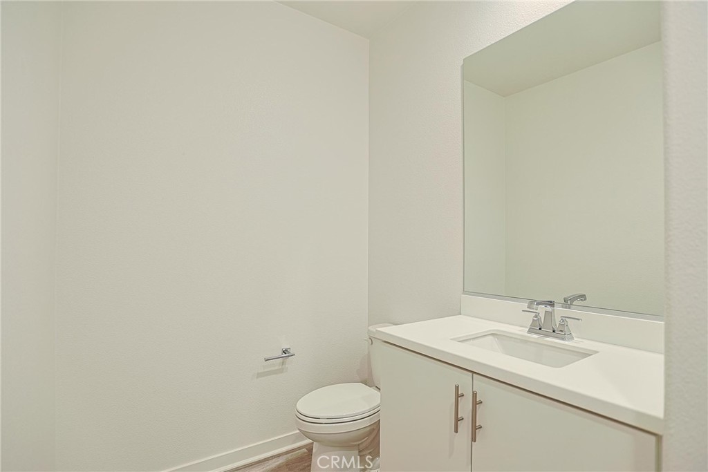 4260 Powell Way, Unit 110 Corona, CA 92883 - Photo 16 of 27 half bathroom downstairs