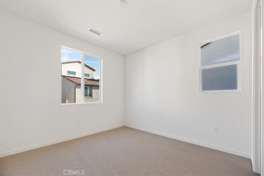 27323 Maverick Place Valencia, CA 91381 - Photo 11 of 18 a view of an empty room with a window