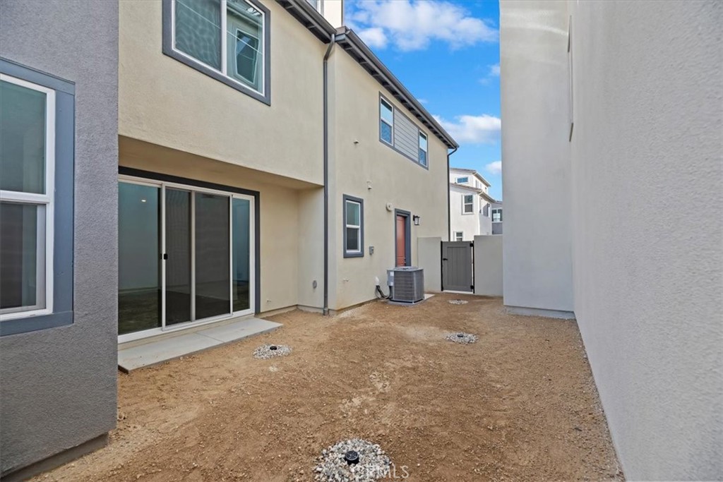 27323 Maverick Place Valencia, CA 91381 - Photo 15 of 18 a view of a house with a backyard