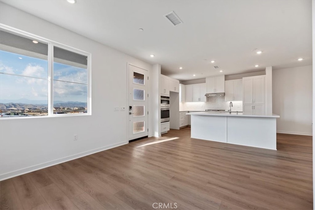 27323 Maverick Place Valencia, CA 91381 - Photo 4 of 18 a view of kitchen with wooden floor