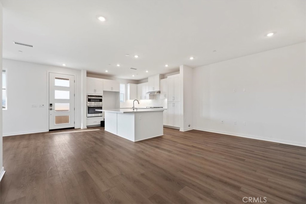 27323 Maverick Place Valencia, CA 91381 - Photo 7 of 18 a view of kitchen with wooden floor
