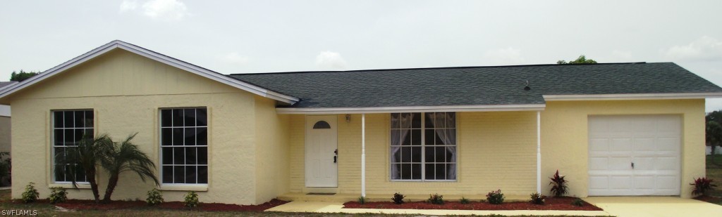 1085 Ridgeway Drive North Fort Myers, FL 33903 - Photo 1 of 25 a front view of a house with glass windows