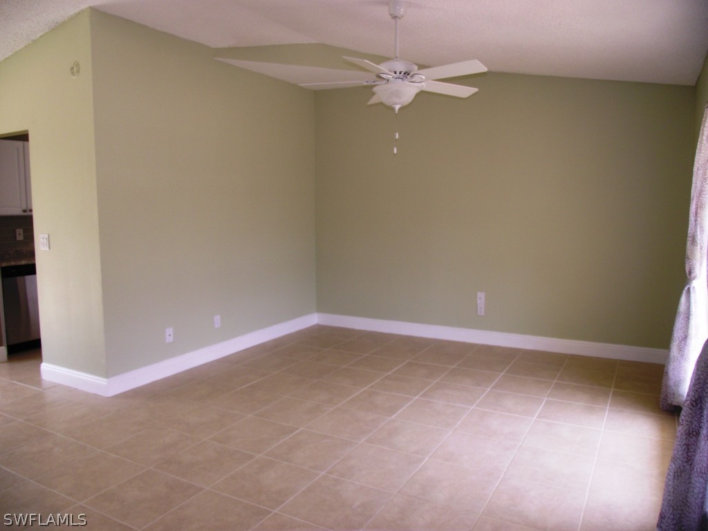 1085 Ridgeway Drive North Fort Myers, FL 33903 - Photo 14 of 25 an empty room with a fan & a ceiling fan