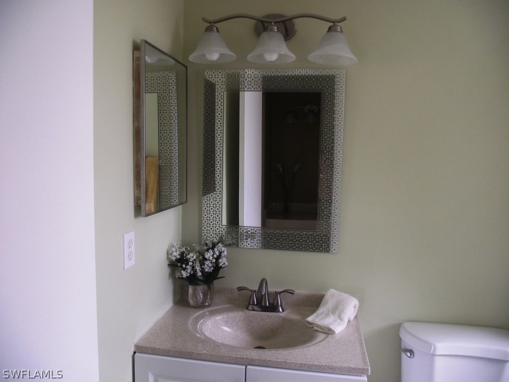 1085 Ridgeway Drive North Fort Myers, FL 33903 - Photo 18 of 25 a bathroom with a sink and a mirror