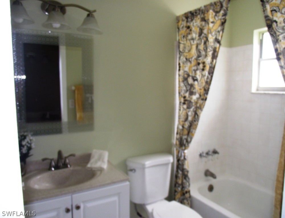 1085 Ridgeway Drive North Fort Myers, FL 33903 - Photo 19 of 25 a bathroom with a sink toilet and shower