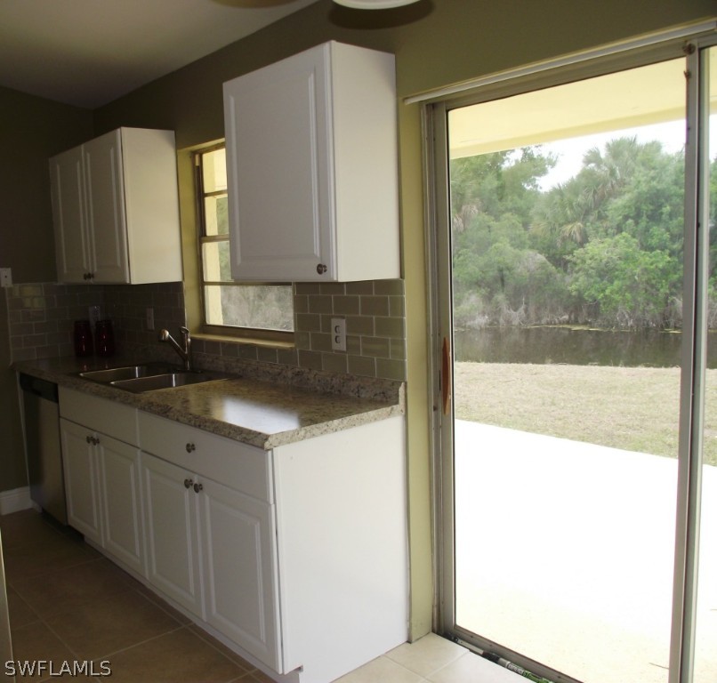 1085 Ridgeway Drive North Fort Myers, FL 33903 - Photo 10 of 25 a kitchen with a sink and large window