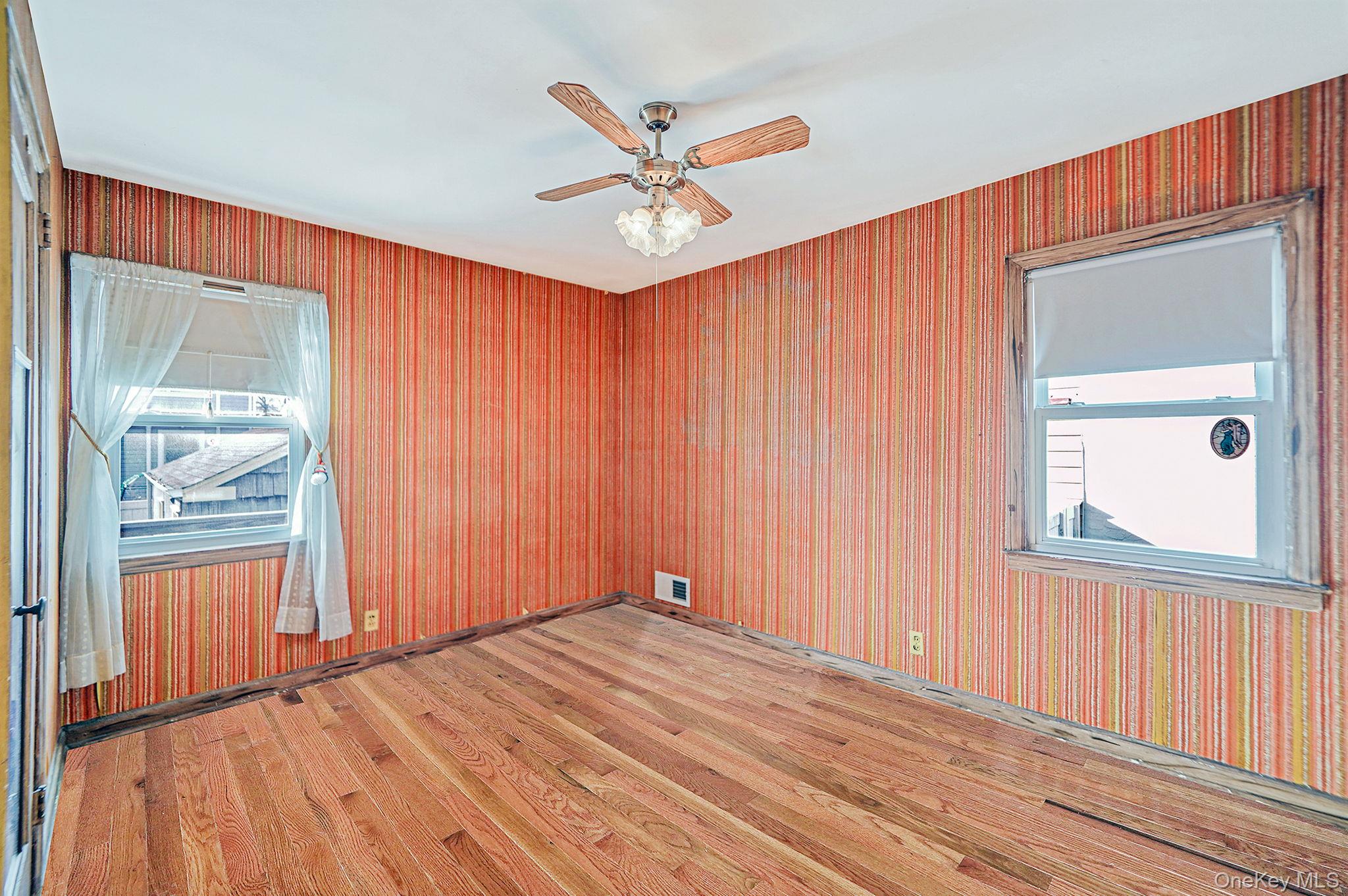 15 Berkshire Road Merrick, NY 11566 - Photo 5 of 11 a view of an empty room with a window