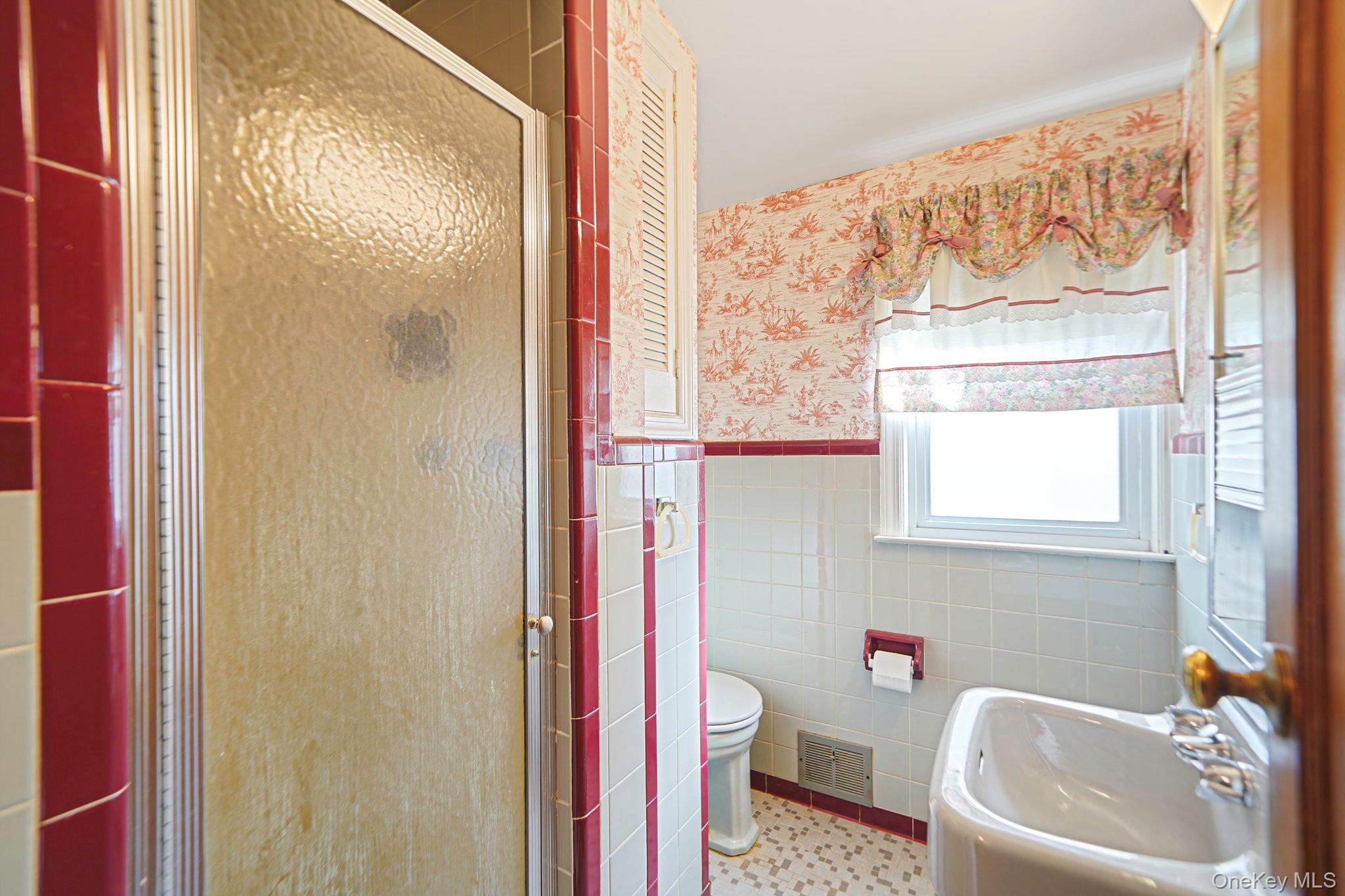 15 Berkshire Road Merrick, NY 11566 - Photo 9 of 11 a bath room with a sink and a toilet