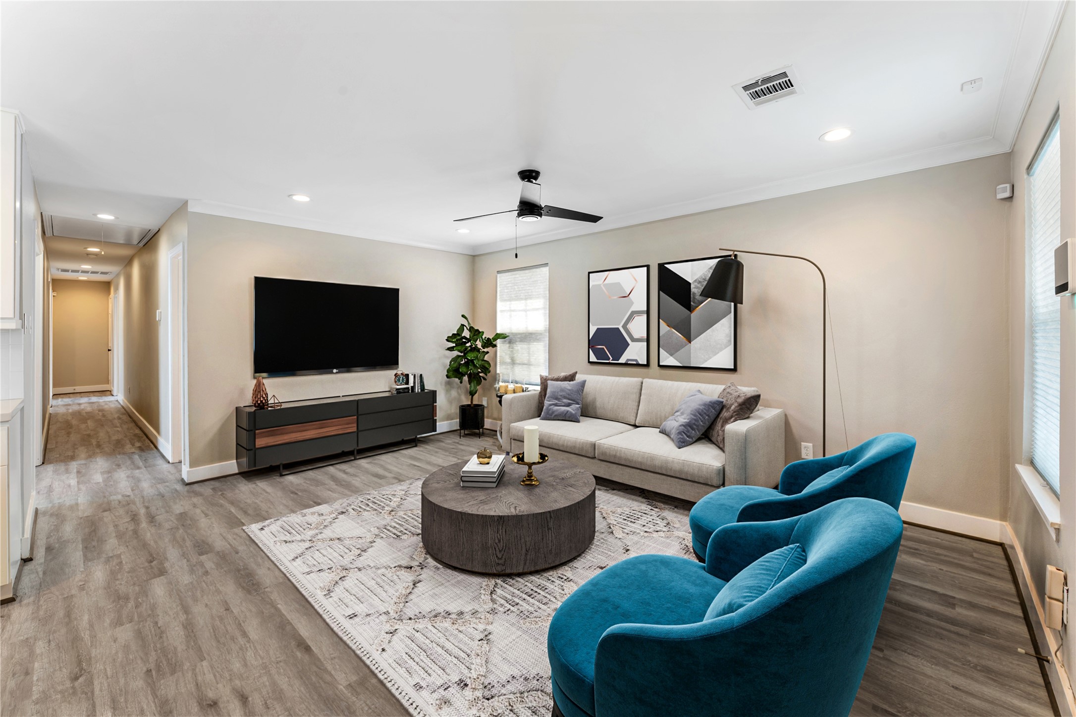 809 East 40th Street Houston, TX 77022 - Photo 12 of 27 Fully updated interior with new flooring, fresh neutral paint, and updated lighting creates a bright and inviting living space. Located just 6 miles from Downtown Houston, this home offers both comfort and convenience. virtual staged