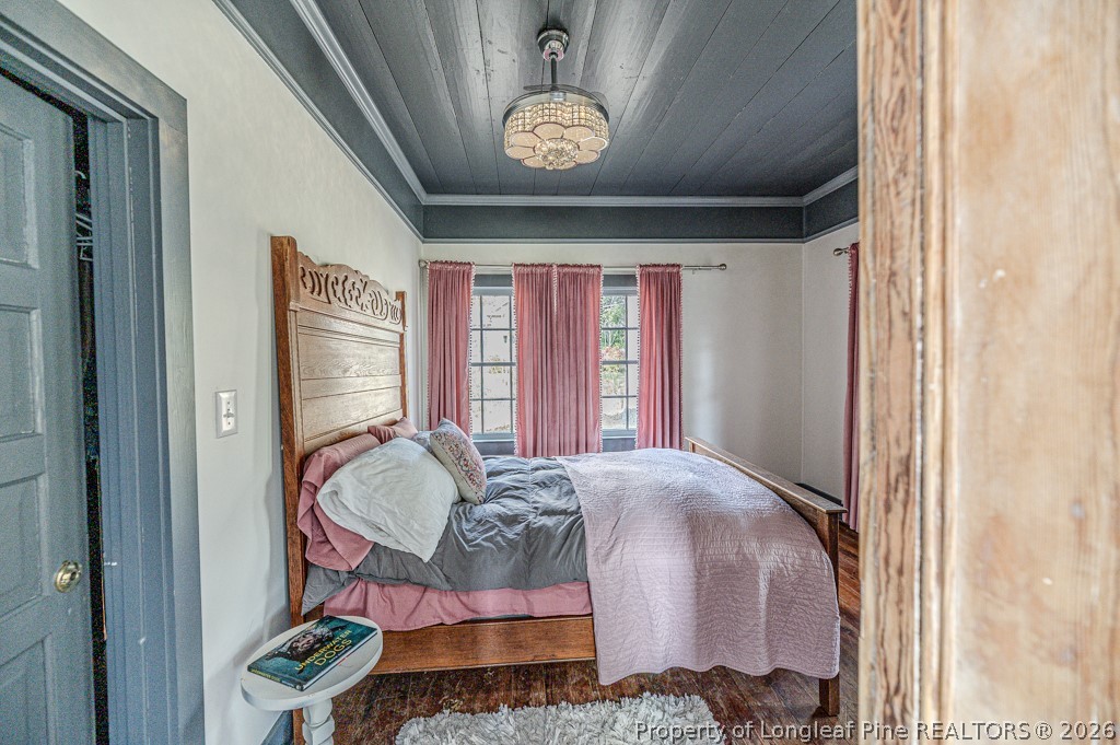 509 Carthage Street Cameron, NC 28326 - Photo 7 of 43 a bed room with a bed and a window