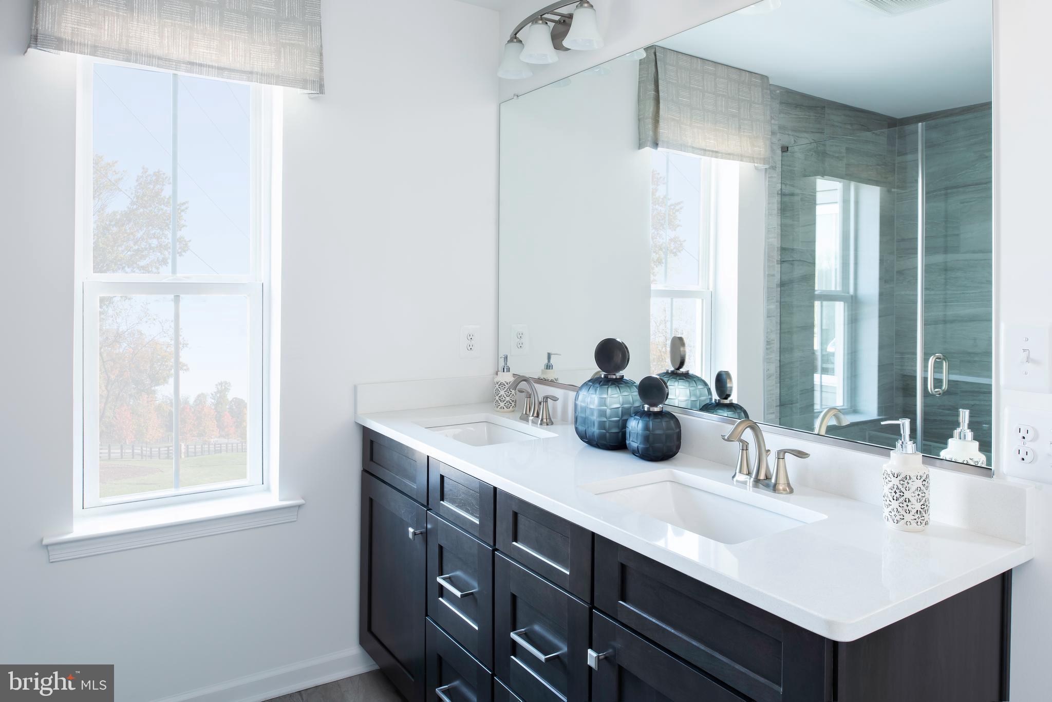 4100 Viewpath Road Ellicott City, MD 21043 - Photo 6 of 23 a bathroom with a double vanity sink and a mirror