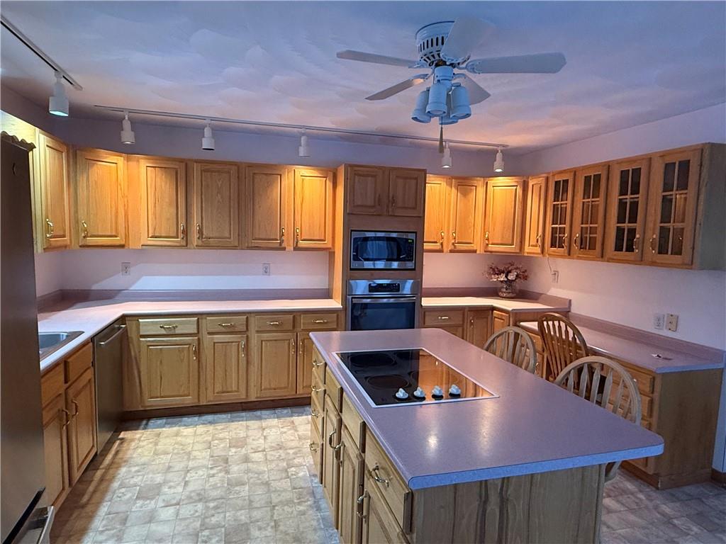 1509 Ray Road Penn Run, PA 15765 - Photo 11 of 33 a kitchen with a stove a sink dishwasher and a refrigerator