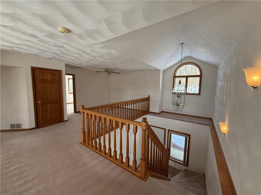 1509 Ray Road Penn Run, PA 15765 - Photo 14 of 33 a view of hallway with stairs and wooden floor