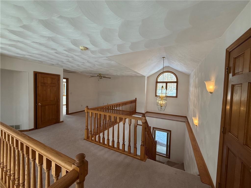 1509 Ray Road Penn Run, PA 15765 - Photo 17 of 33 a view of a hallway with a couches chair and a kitchen view