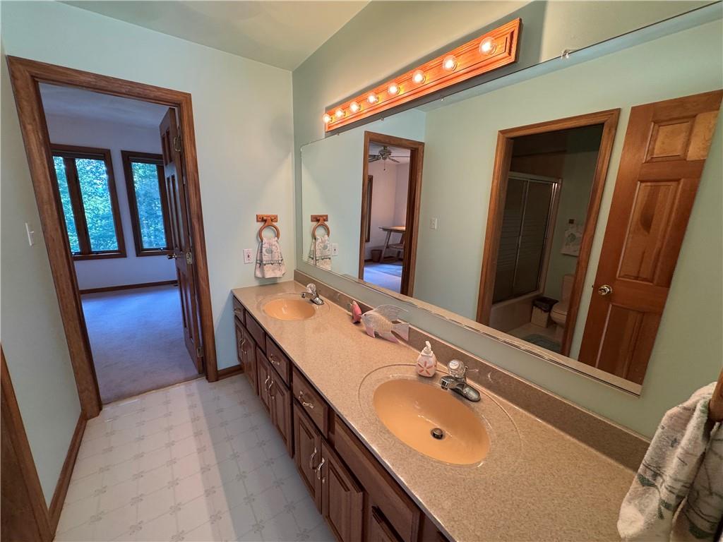 1509 Ray Road Penn Run, PA 15765 - Photo 23 of 33 a bathroom with a double vanity sink and a mirror