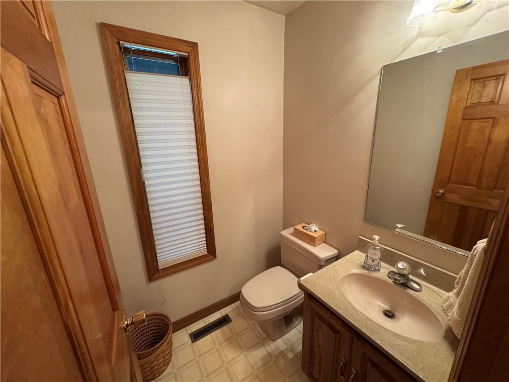 1509 Ray Road Penn Run, PA 15765 - Photo 24 of 33 a bathroom with a sink a toilet and mirror