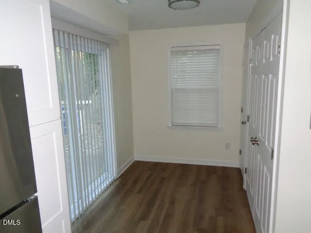 a bathroom with a granite countertop sink and mirror