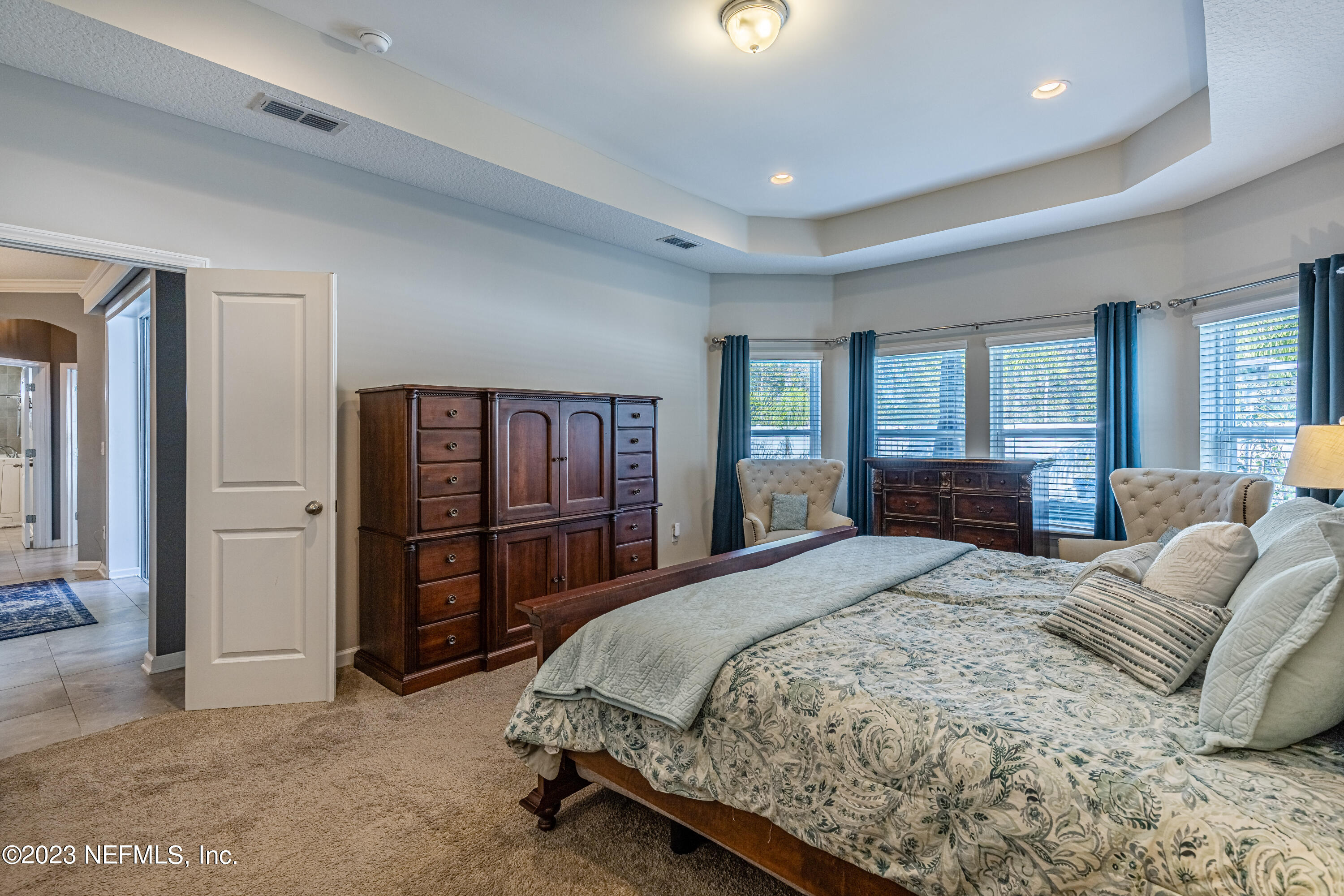 871 Bent Creek Drive St. Johns, FL 32259 - Photo 27 of 71 a spacious bedroom with a large bed and a dresser