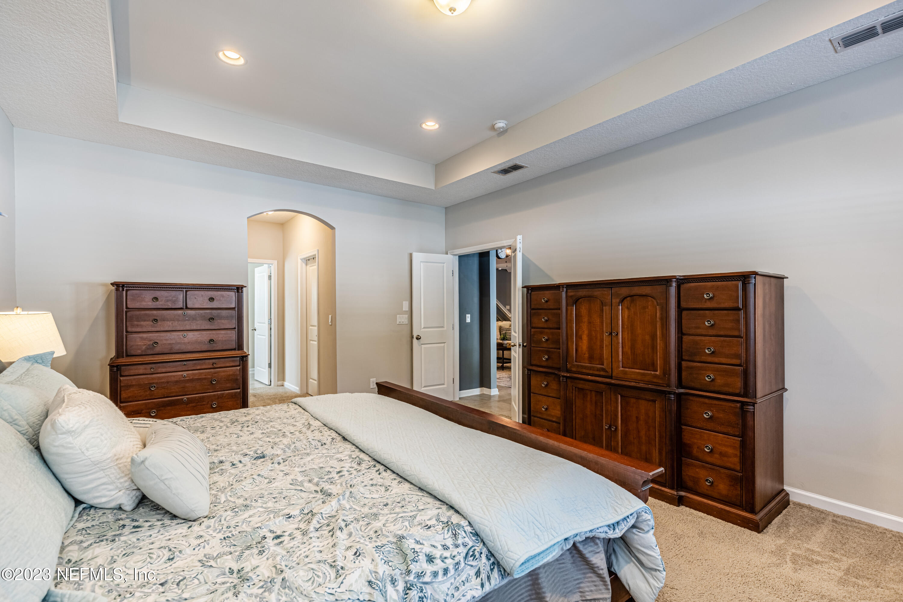 871 Bent Creek Drive St. Johns, FL 32259 - Photo 29 of 71 a bedroom with a bed a dresser and a book shelf