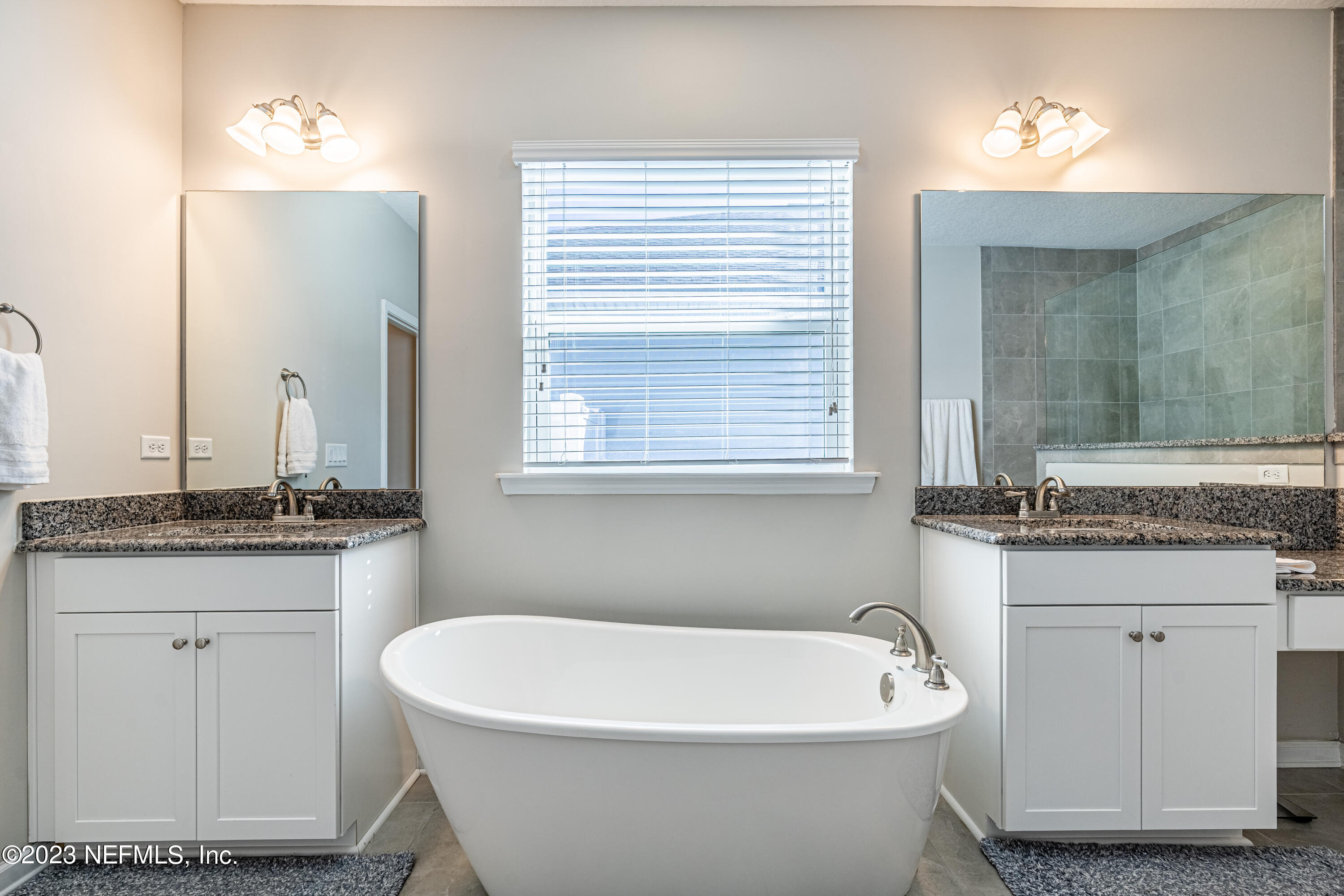 871 Bent Creek Drive St. Johns, FL 32259 - Photo 31 of 71 a white bath tub sitting next to a white sink