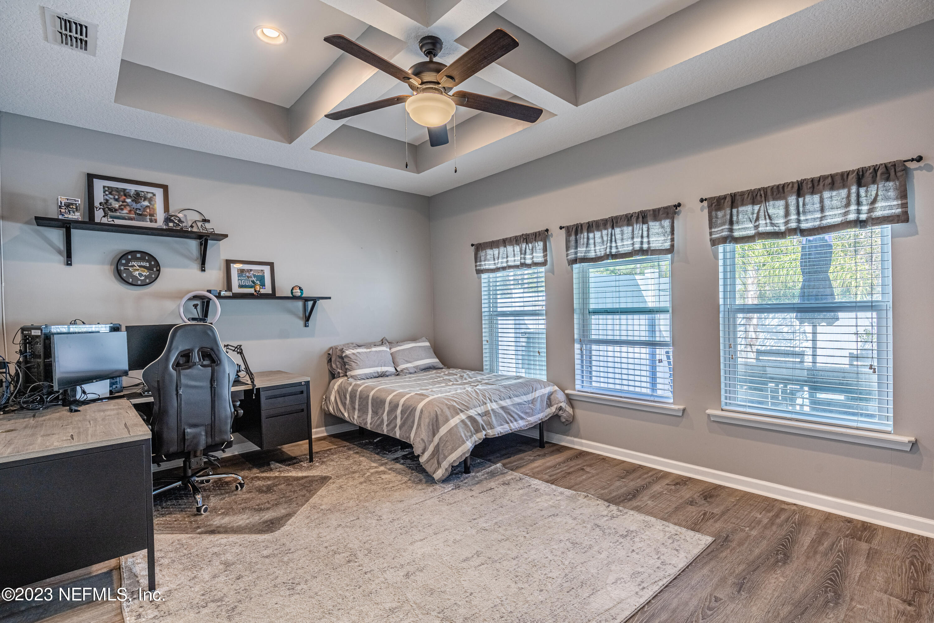 871 Bent Creek Drive St. Johns, FL 32259 - Photo 35 of 71 a spacious bedroom with a bed a couch and a large window